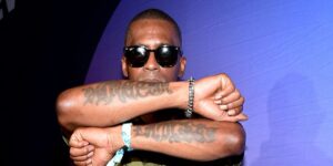 rico-wade-poses-for-a-photo-with-his-arms-crossed-in-front-of-his-chest-displaying-his-forearm-tattoos.jpg