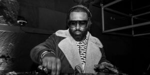 madlib-has-his-hands-on-a-dj-deck.jpg