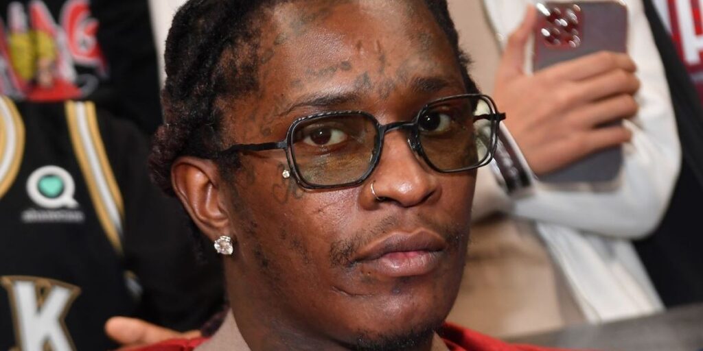 rapper-young-thug-attends-the-game-between-the-phoenix-suns-and-the-atlanta-hawks-at-state-farm-arena-on-february-03-2022-in-at.jpg