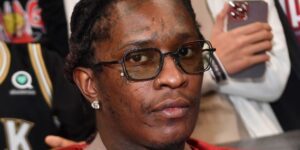 rapper-young-thug-attends-the-game-between-the-phoenix-suns-and-the-atlanta-hawks-at-state-farm-arena-on-february-03-2022-in-at.jpg
