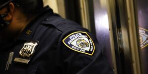 a-new-york-police-department-nypd-officer-is-seen-in-a-subway-train-at-night-in-new-york-on-august-11-2024.jpg