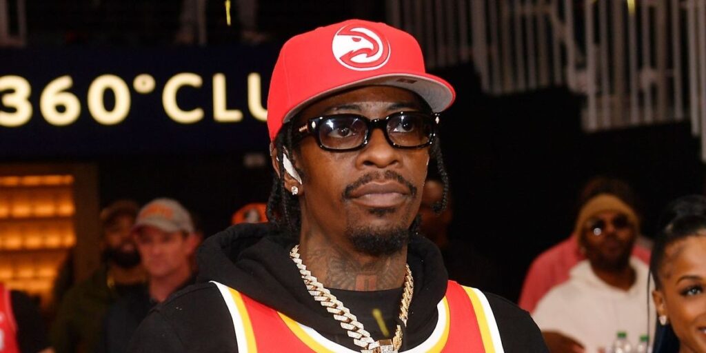 rapper-rich-homie-quan-performs-during-game-six-of-the-eastern-conference-first-round-playoffs-between-the-atlanta-hawks-and-the.jpg