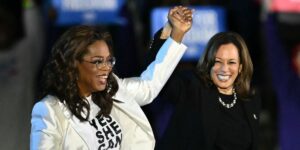 oprah-winfrey-l-holds-up-us-vice-president-and-democratic-presidential-candidate-kamala-harris-hand-as-she-arrive-onstage-dur.jpg