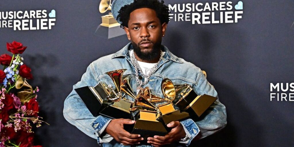 kendrick-lamar-poses-with-the-record-of-the-year-best-rap-performance-song-of-the-year-best-music-video-best-rap-song-awards.jpg