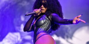 megan-thee-stallion-with-a-tight-body-suit-and-holding-a-mic.jpg