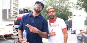 method-man-and-redman-wearing-street-clothes-posing-for-a-photo-backstage-and-outside-in-the-sun.jpg