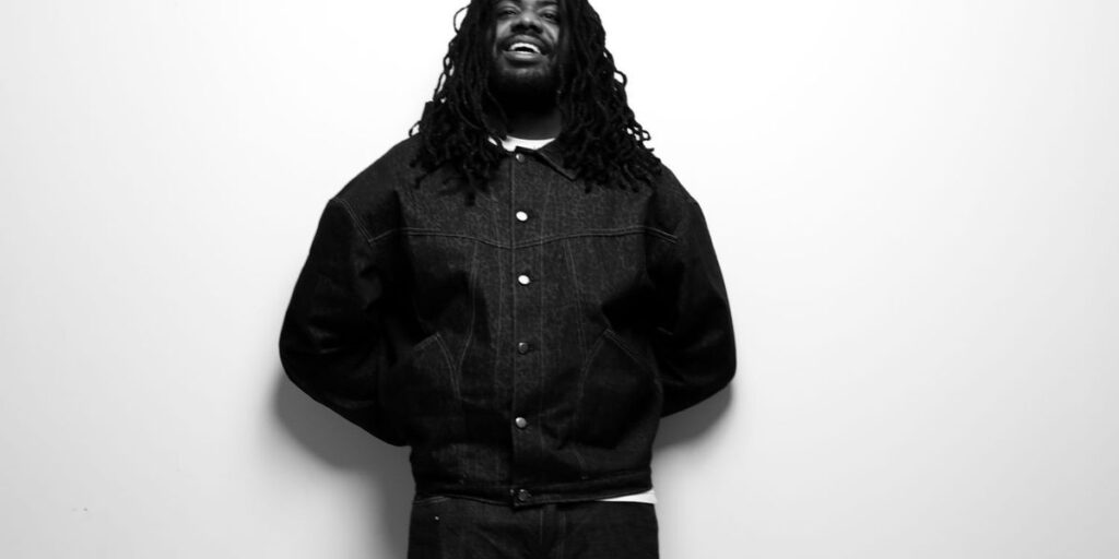 mike-in-a-black-and-white-photo-with-a-jean-jacket-on.jpg