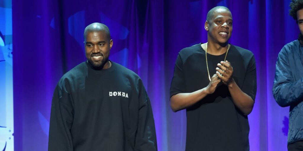 kanye-west-and-jay-z-wearing-all-black-standing-next-to-each-other-at-the-2015-tidal-launch-event.jpg