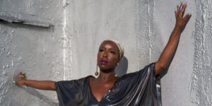 dj-reborn-with-a-headwrap-and-her-hands-up.jpg