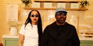 a-black-man-and-woman-posing-for-a-photo-inside-of-a-bakery.jpg