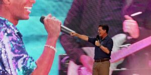 stephen-colbert-points-to-jon-batiste-on-the-other-side-of-the-stage-at-the-we-love-nyc-the-homecoming-concert-at-the-great-law.jpg